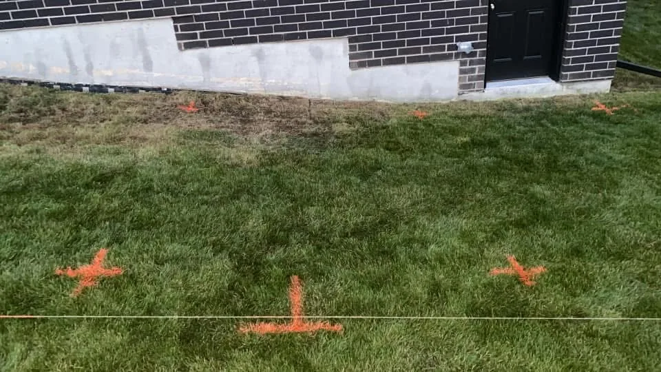 Deck footprint marked with string lines and orange paint